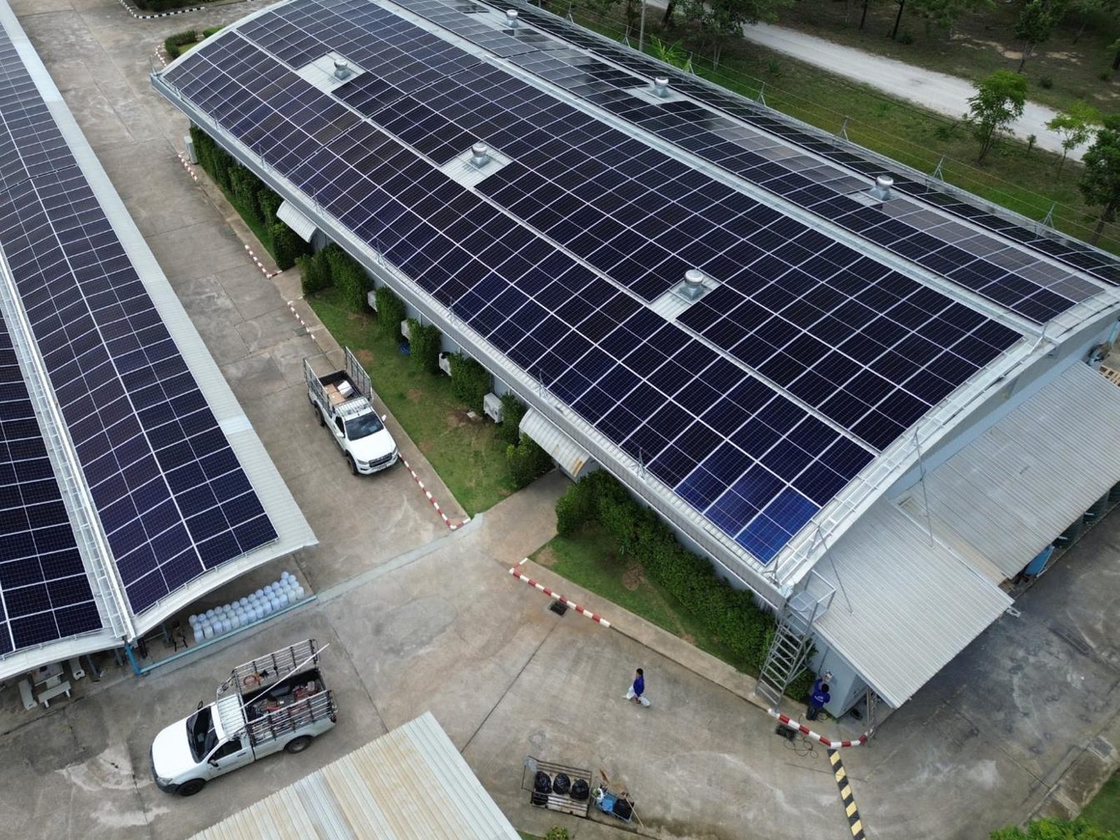Aerial view of the completed solar array across the main factory roof